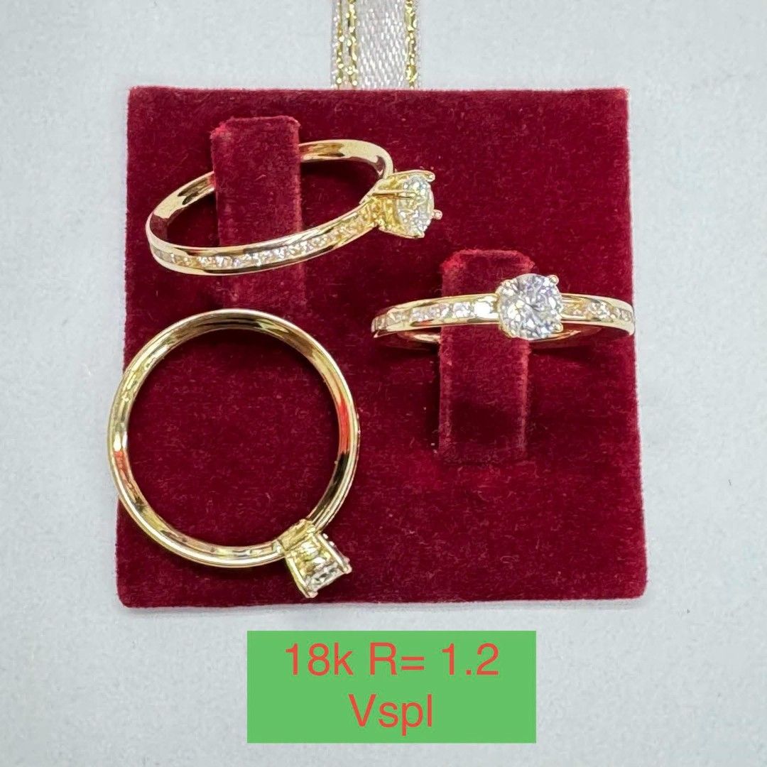 18k Gold Ring with Stone (Category: Rings) located in Marikina City. Submitted by emmstaule (Listing ID 1468713492, Image 1). Description: - Set of 3 gorgeous gold rings - 18k rating clearly visible on tag - Features sparkling pave diamonds and central round stones - Solid construction with a polished, shiny finish - Clean condition, ready to wear - Comes with the red display card as pictured.