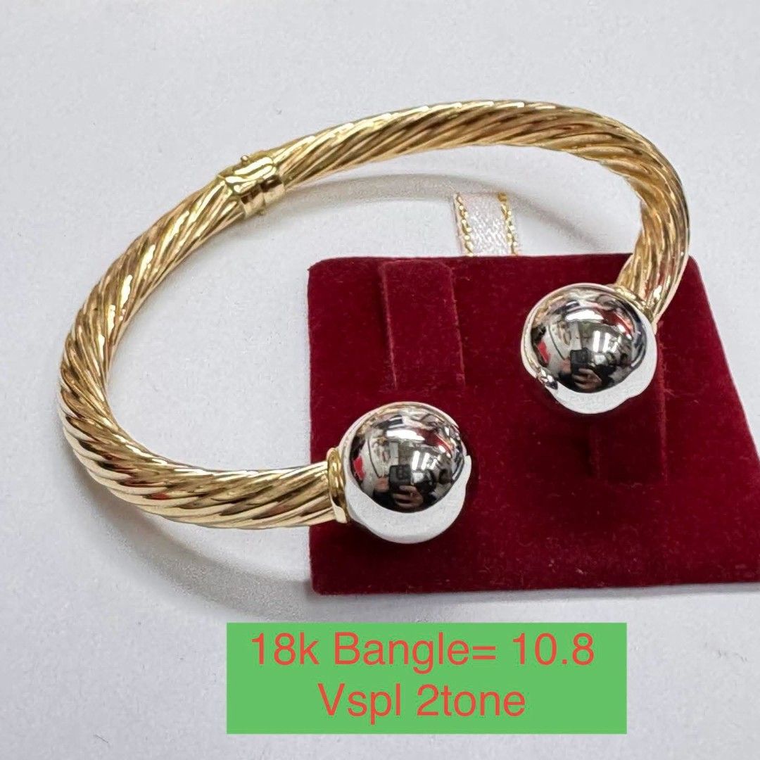 18k Vspl 2tone Bangle (Category: Bracelets) located in Marikina City. Submitted by emmstaule (Listing ID 1468714252, Image 1). Description: - Material: Authentic 18k Gold (Two-tone style) - Weight: 10.8 grams - Design: Twisted cable with smooth round ball ends - Closure: Secure hinge closure - Features: Solid build that catches the light beautifully - Condition: Brand new / Excellent quality.