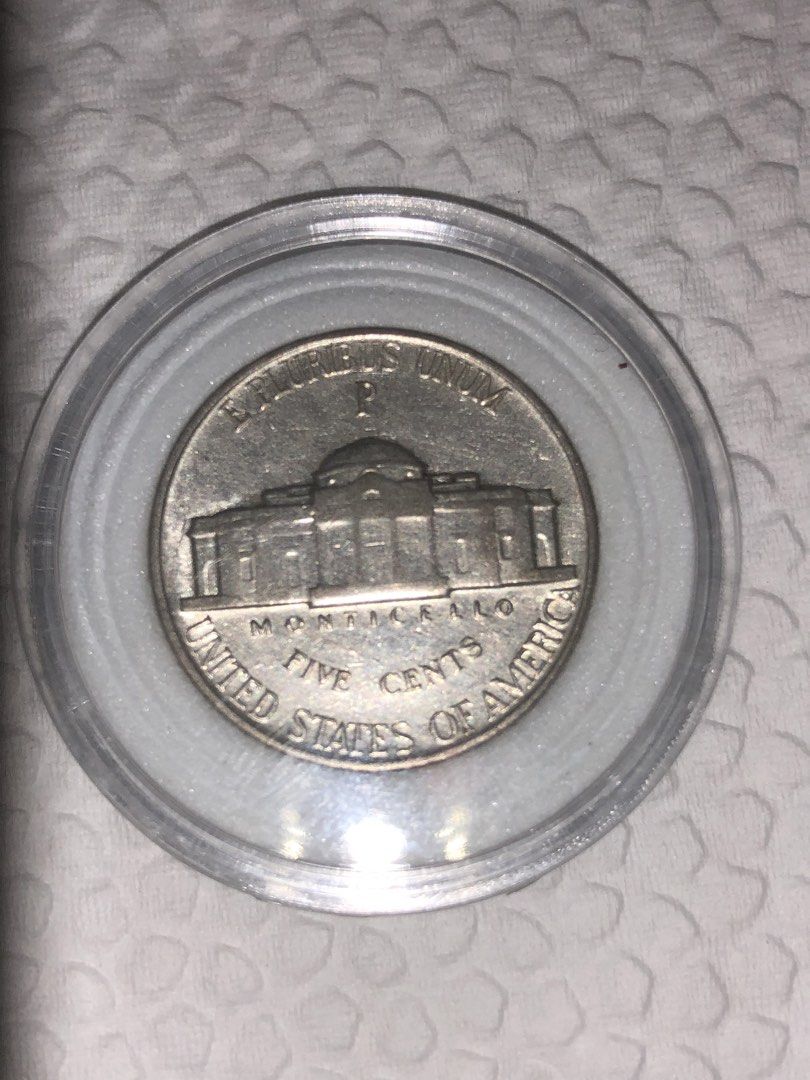 1943 P US Jefferson Nickel Five Cents (Category: Currency) located in Muntinlupa City. Submitted by kitty_meow87 (Listing ID 1468752258, Image 1). Description: - US Jefferson nickel minted in 1943 - Features 'P' mint mark above Monticello on the reverse - Obverse showcases Thomas Jefferson profile with 'In God We Trust' and 'Liberty' - Silver-colored metal composition - Comes safely stored inside a clear plastic coin capsule container - Perfect f