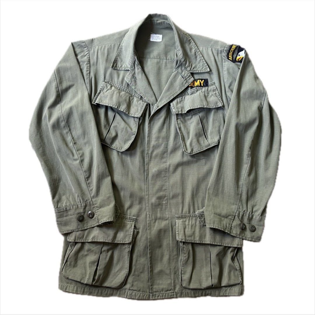 1970s US Army Jungle Fatigue Jacket (Extra Small Regular) (Category: Coats, Jackets and Outerwear) located in Manaoag. Submitted by mayonaise.store (Listing ID 1468796808, Image 1). Description: US Army 1970s 101st Airborne Jungle Jacket This is an authentic US Army 4th pattern tropical combat coat, commonly known as a jungle jacket, manufactured during the late Vietnam War era. First introduced in the mid-1960s to withstand tropical heat and moi