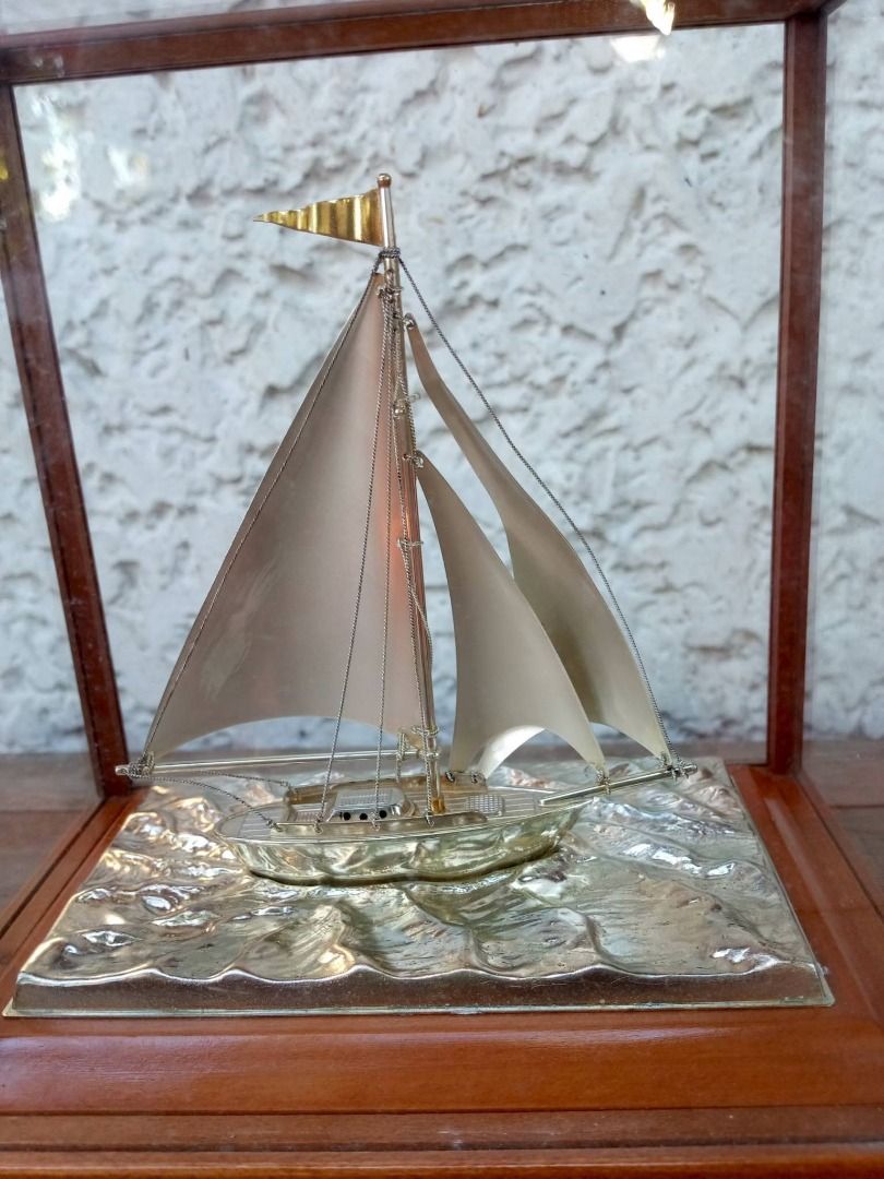 1997 Silver Sailboat Trophy/Figurine (Category: Vintage Collectibles) located in Caloocan City. Submitted by safetree_07089b (Listing ID 1468739230, Image 3). Description: - Vintage 1997 Emperor's Birthday Cup runner-up award miniature sailboat model - Encased in a clean, dust-free glass display with a sturdy wooden frame - Features detailed rigging, tiny masthead flag, and metallic finish on sails and hull - Beautiful textured wave base with an 