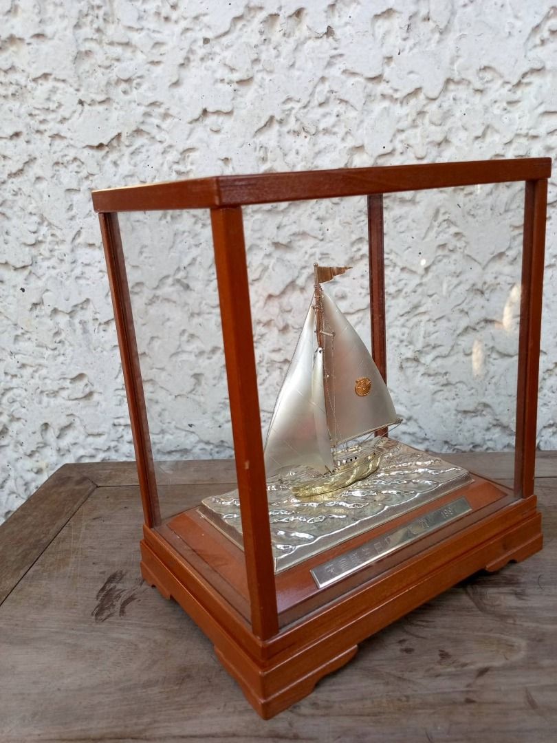 1997 Silver Sailboat Trophy/Figurine (Category: Vintage Collectibles) located in Caloocan City. Submitted by safetree_07089b (Listing ID 1468739230, Image 2). Description: - Vintage 1997 Emperor's Birthday Cup runner-up award miniature sailboat model - Encased in a clean, dust-free glass display with a sturdy wooden frame - Features detailed rigging, tiny masthead flag, and metallic finish on sails and hull - Beautiful textured wave base with an 