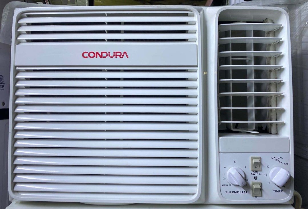 1HP Condura Window Type Air Conditioner (Category: Air Conditioning and Heating) located in Manila. Submitted by almira_03 (Listing ID 1468750813, Image 1). Description: - Brand: Condura Window Type Aircon - Color: Clean White - Controls: Dual rotary knobs for thermostat and timer, plus a manual switch toggle - Airflow: Adjustable louvers on the right side - Condition: Good runing condition, cool fast - Free delivery - Cod payment - Same day deli