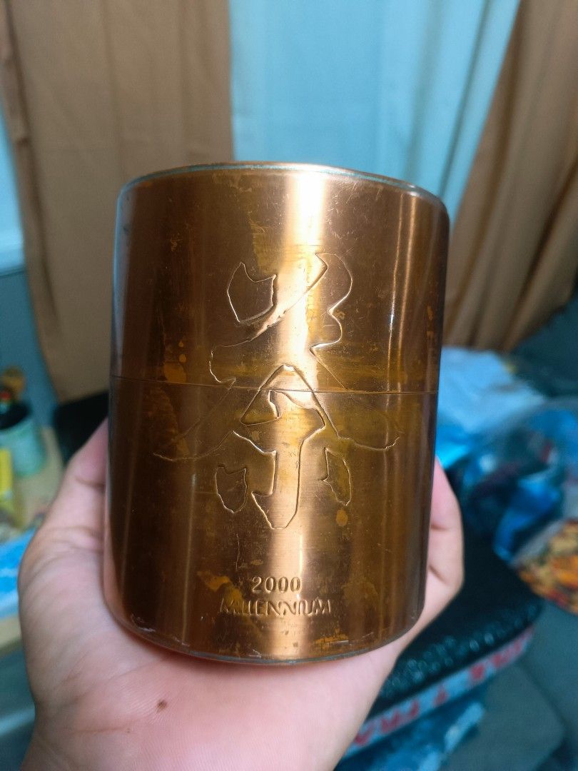 2000 Millennium copper tea caddy container storage jar (Category: Food Organization & Storage) located in Manila. Submitted by mateochest99469 (Listing ID 1468912073, Image 1). Description: - Vintage copper tea caddy with 2000 Millennium stamp and Chinese characters - Features a secure inner lid with a top knob - Base includes an authentic Chinese hallmark - Displays natural surface wear, scratches, and beautiful aged patina - Great collectible p