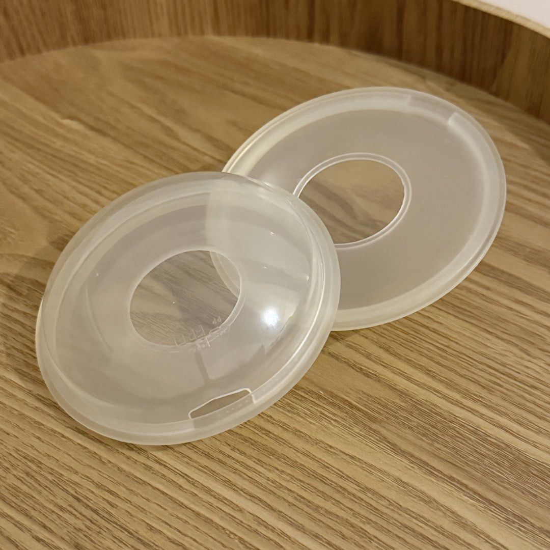 2pcs set Orange & Peach Milk Saver Catcher Breast Shells (Category: Breastfeeding & Bottle Feeding) located in Marikina City. Submitted by lovegoeson (Listing ID 1468787152, Image 1). Description: - Brand: Orange & Peach - Includes: 1 pair of milk saver breast shells - Function: Catches breastmilk let-downs while nursing on the opposite side - Design: Leakproof, lightweight, and comfortable shape that fits inside regular nursing bras - Material: 
