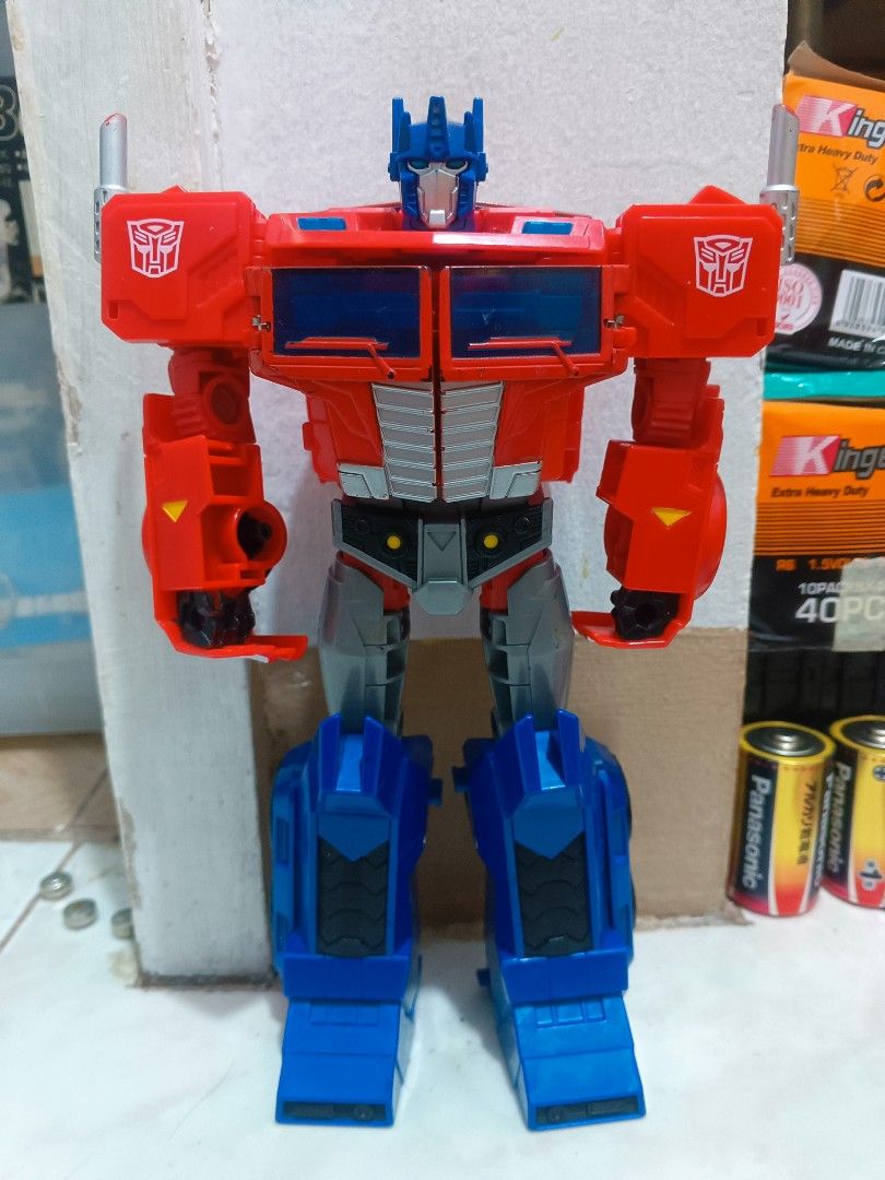 2pcs Transformers Optimus Prime Action Figure Robot Toy (Category: Action & Battle Toys) located in Manila. Submitted by mateochest99469 (Listing ID 1468910742, Image 3). Description: - Iconic Optimus Prime action figure in classic red, blue, and grey - Fully articulated joints for custom poses in robot mode - Detailed truck mode features on the legs and torso - Durable and solid plastic build - Perfect classic collector's piece for Transformers 