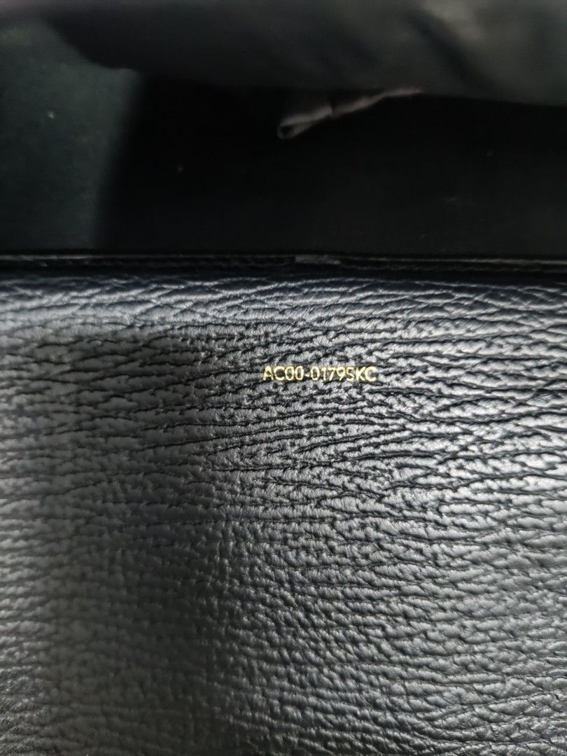 3.1 Phillip Lim Black Leather Shoulder Bag (Category: Luxury Bags & Wallets) located in Pateros City. Submitted by harry062182 (Listing ID 1468873154, Image 2). Description: - Brand: 3.1 Phillip Lim - Material: Black textured leather with silver-tone hardware - Authenticity: Serial number AC00-0179SKC stamped inside - Features: Structured top handle, adjustable shoulder strap, and stylish exterior zipper details - Interior: Clean lining with stam
