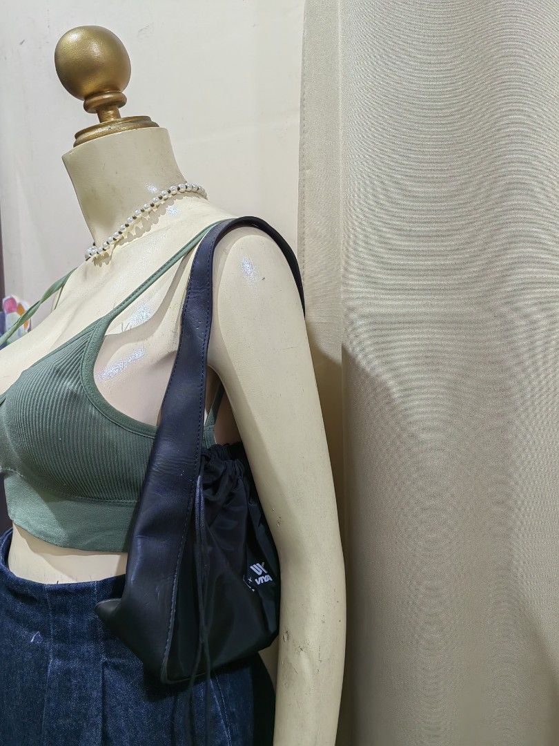 3CE x Viya Black Drawstring Shoulder/kili Bag (Category: Shoulder Bags) located in Makati City. Submitted by prelovedtreatedwithlove (Listing ID 1468886986, Image 1). Description: - Brand: 3CE x Viya collaboration - Color: Classic Black with white printed logos - Material: Soft nylon body with sturdy leather - Interior: Roomy and spacious for all your daily essentials - Condition: Excellent/Clean look - Style: Versatile, minimalist design that go