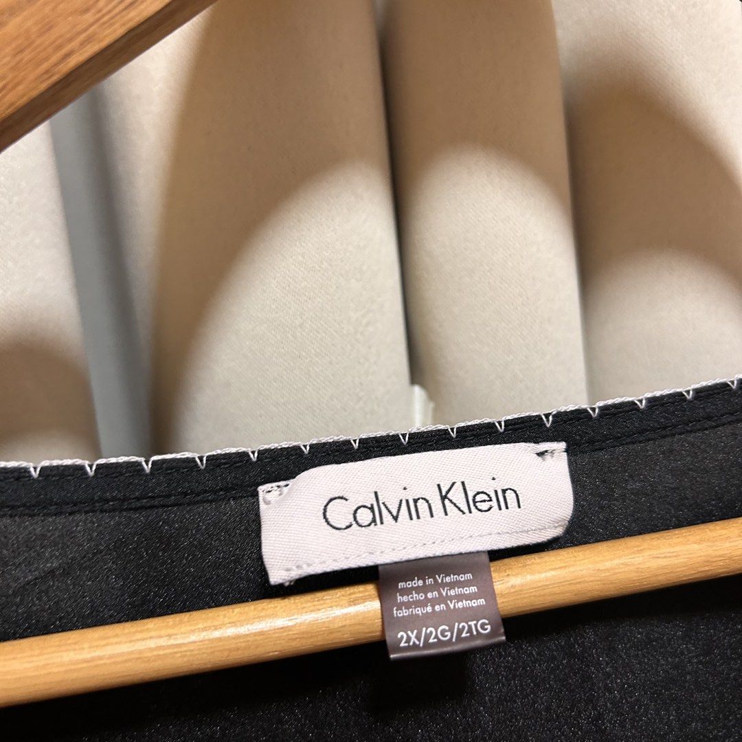 3XL Calvin Klein Black Top (Category: Blouses) located in Rizal. Submitted by from99abovecloset (Listing ID 1468822662, Image 2). Description: CODE: 104 Size: 3XL Armhole (laid flat):12” Bust (around): 62” Length (laid flat): 30” Soft poly | loose | with minor loose threads can be repair or cut.
