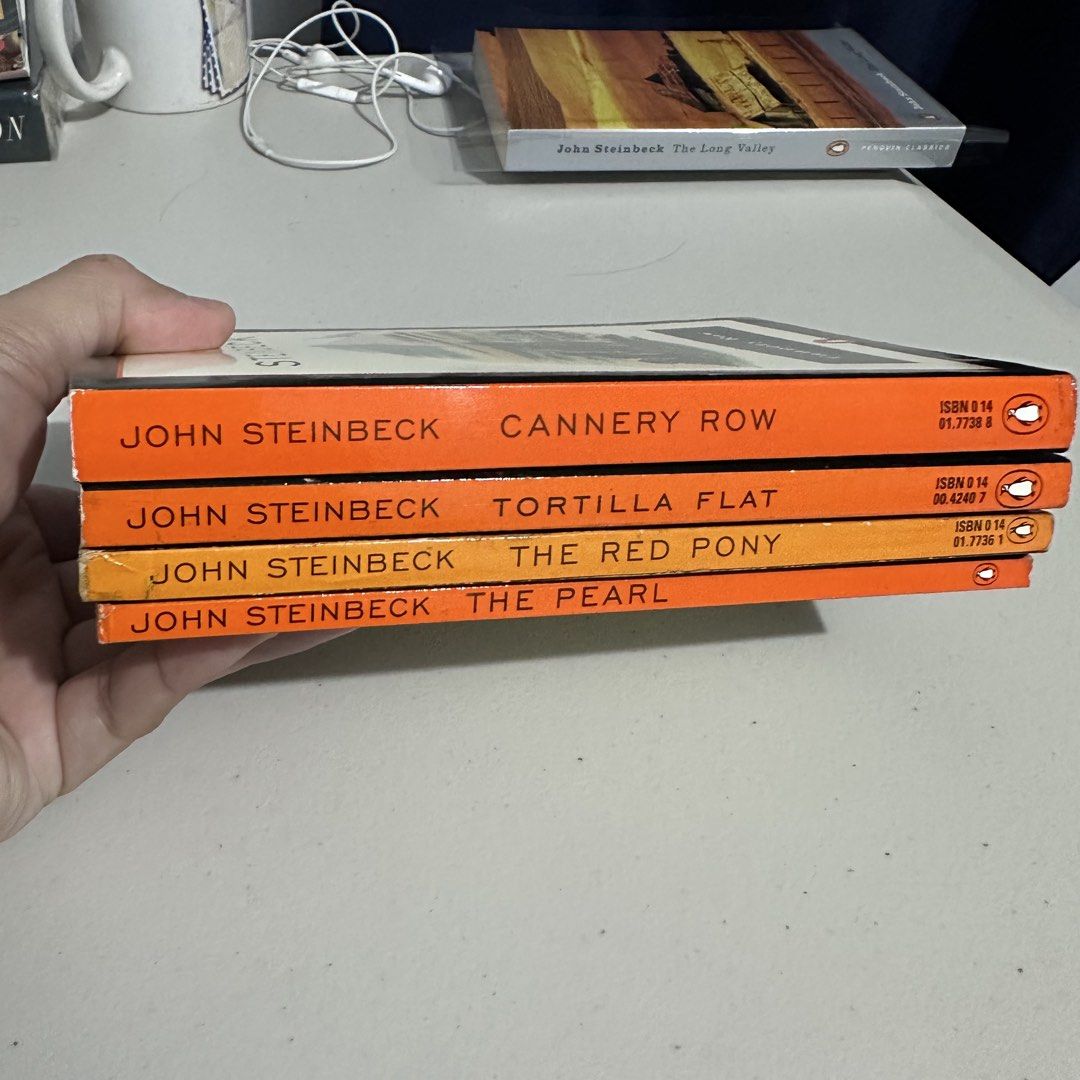 4 Short Novels by John Steinbeck (Category: Storybooks) located in General Tinio. Submitted by tindangaklat (Listing ID 1468843339, Image 2). Description: Sold as set only. The Pearl Red Pony Cannery Row Tortilla Flat.