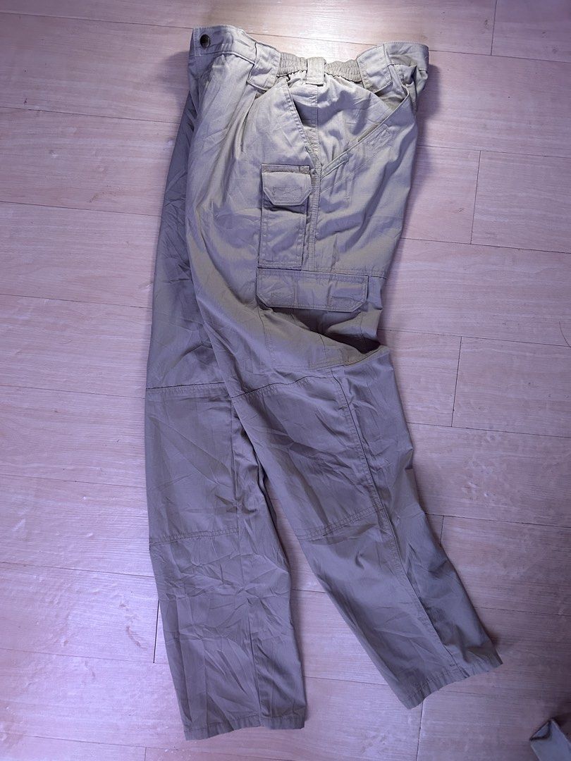 5.11 Tactical Cargo Pants Khaki (Category: Trousers) located in Dipolog. Submitted by adrian281994 (Listing ID 1468758626, Image 3). Description: - Brand: 5.11 Tactical Size 36 fits 34 waist - Material: Durable ripstop fabric - Pockets: Multiple utility pockets on sides and thighs - Comfort: Elastic waistband section on the back - Durability: Reinforced knees for heavy-duty use - Extras: D-ring attached near the front belt loop.