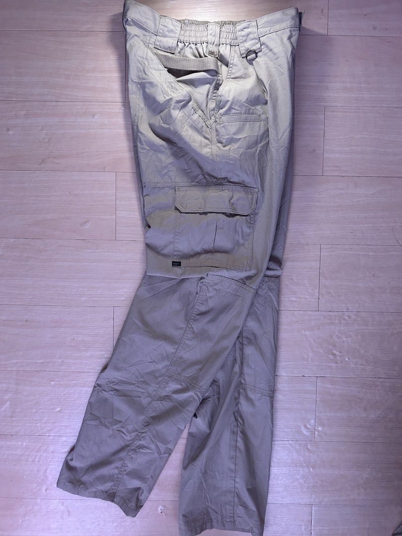 5.11 Tactical Cargo Pants Khaki (Category: Trousers) located in Dipolog. Submitted by adrian281994 (Listing ID 1468758626, Image 2). Description: - Brand: 5.11 Tactical Size 36 fits 34 waist - Material: Durable ripstop fabric - Pockets: Multiple utility pockets on sides and thighs - Comfort: Elastic waistband section on the back - Durability: Reinforced knees for heavy-duty use - Extras: D-ring attached near the front belt loop.