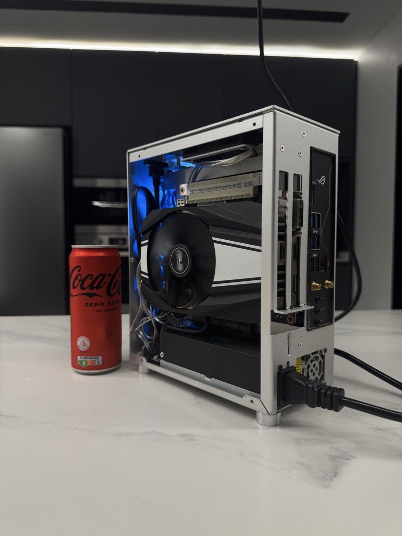 5.3L MINI ITX RYZEN 5 3600X RTX 2060 16/512 GAMING PC (Category: Desktops) located in Singapore. Submitted by elite.tech (Listing ID 1468839756, Image 2). Description: One of the smallest of its kind, built into the METALFISH S3 CASING. CPU: Ryzen 5 3600X GPU: Asus Phoenix RTX 2060 6GB RAM: 2x8GB HYPERX DDR4 SSD: 512GB NVME SSD MB: ASUS ROG B450I Gaming (bios updated, can run 5000 gen cpu Cooler: NOCTUA 🔥🔥🔥.