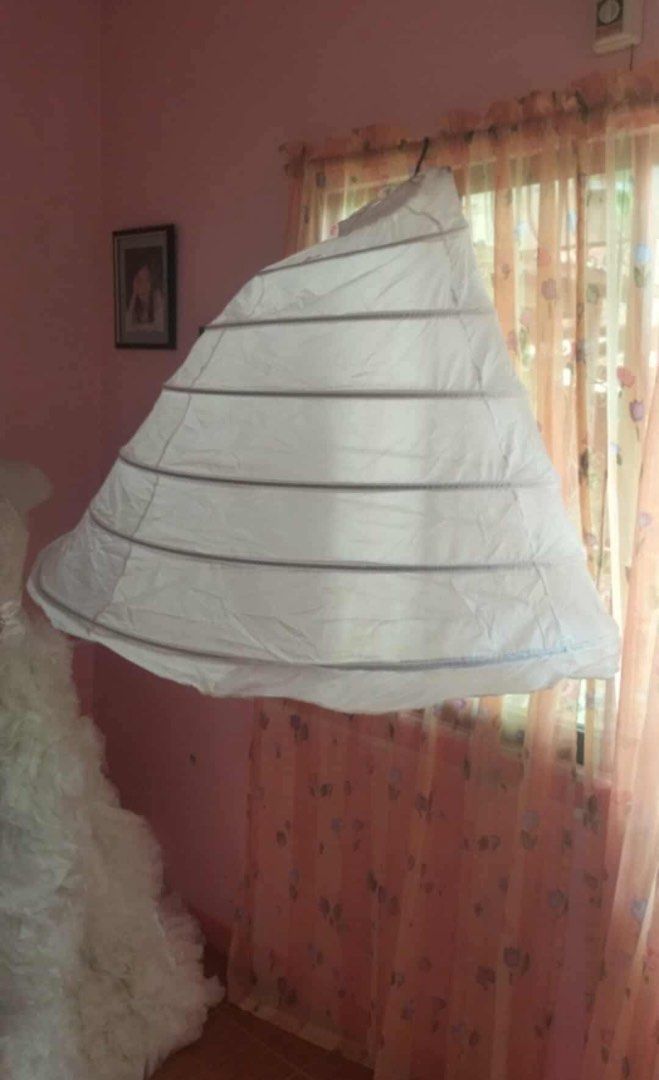 6 Hoops Petticoat (Category: Evening dresses & gowns) located in Bacoor. Submitted by queenkwens21 (Listing ID 1468761222, Image 2). Description: - Color: White (I also have 8 hoops) - Style: 6-hoop petticoat for maximum ballgown fullness and structure - Waist: Adjustable drawstring fits various sizes comfortably - Storage: Collapsible design folds flat for easy travel and storage - Availability: Multiple pieces available.