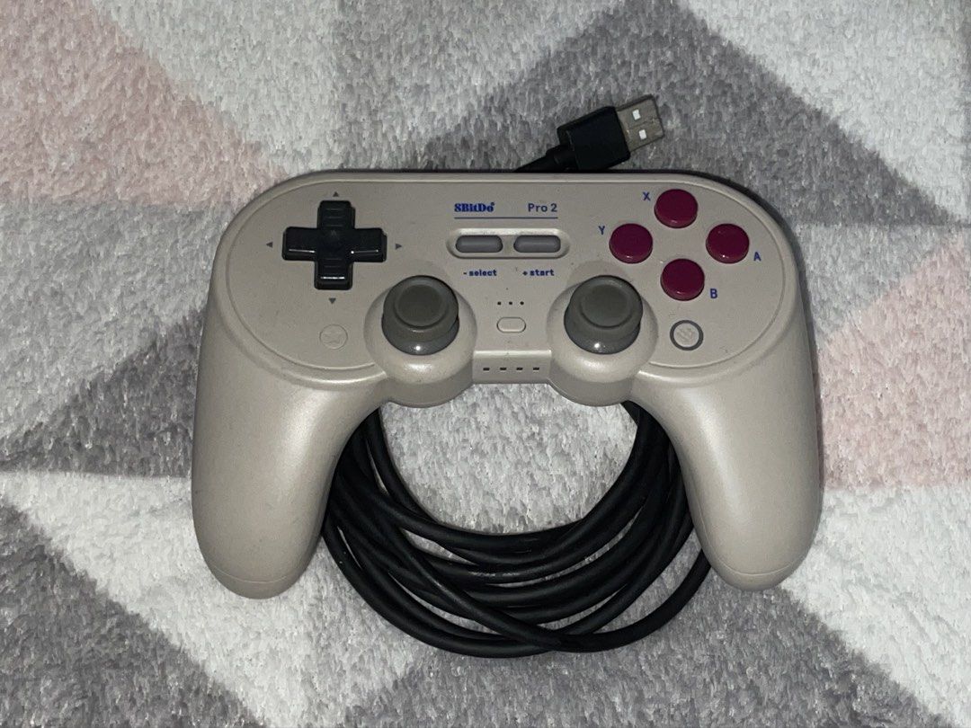 8BitDo Pro 2 Wired Gamepad Controller for Switch Windows (Category: Controllers) located in Quezon City. Submitted by mariikari (Listing ID 1468867599, Image 2). Description: - Model: 8BitDo Pro 2 Wired Gamepad - Color: Beige body, dark red buttons, black D-pad - Compatibility: Nintendo Switch and Windows - Condition: Like new, tested once, zero scratches - Inclusions: original box, and instruction manual.