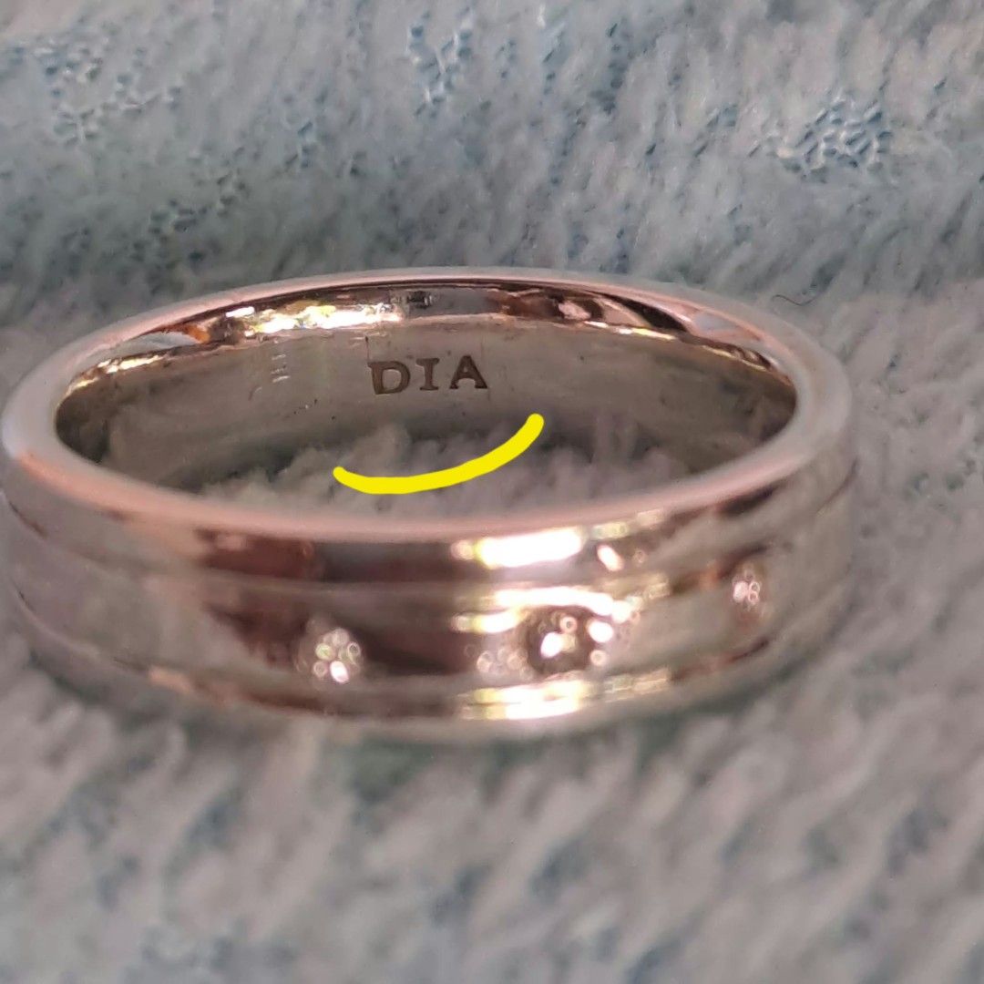 925 Silver Diamond Ring with Three Stone Settings (Category: Rings) located in Pila. Submitted by ester_aurea (Listing ID 1468781058, Image 2). Description: Silver 925 with 3 diamond stones 3 markings 925- Dia- and very small markings sa loob size 9 - 9.5 fixed price plus SF gcash payment - Material: Solid silver stamped with 925 - Stones: Three small round stones flush set on the front face - Design: Two grooved parallel lines running horizontal