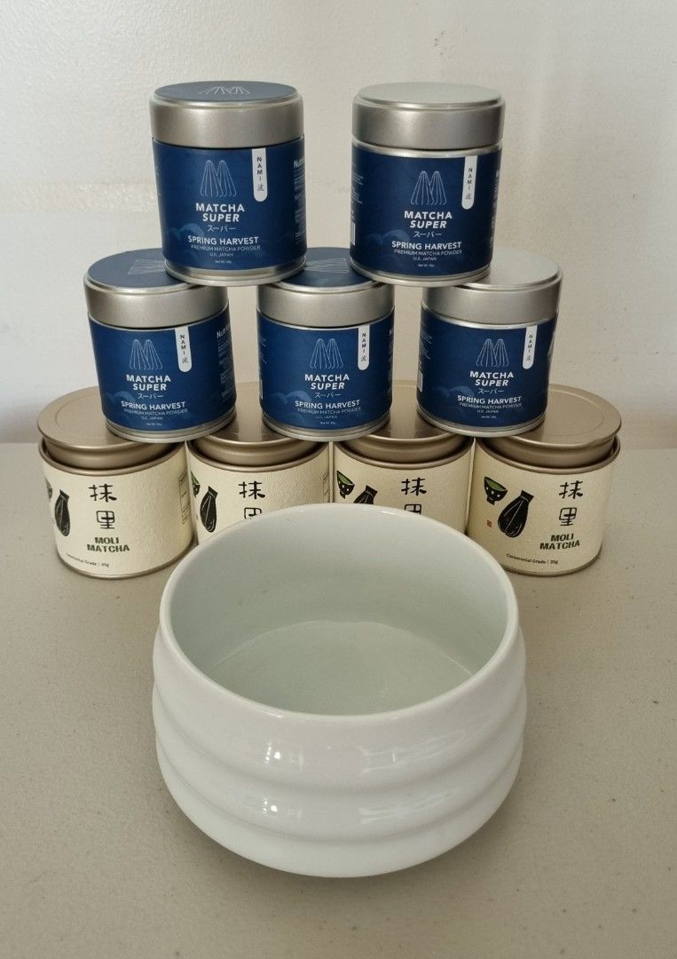 9 Empty Matcha Tins + FREE Matcha Bowl (Category: Coffee & Tea Tableware) located in Muntinlupa City. Submitted by prh-87494 (Listing ID 1467054999, Image 1). Description: Read: Upon close inspection, one Moli tin and one SuperFood Grocer tin have a dent (see photos) - 9 clean and empty matcha tins with bowl - 4x Moli Matcha ceremonial grade tins (35g each) - 5x Superfood Grocer Nami (30g each) - Includes a white ceramic tea bowl with a ribbed ex