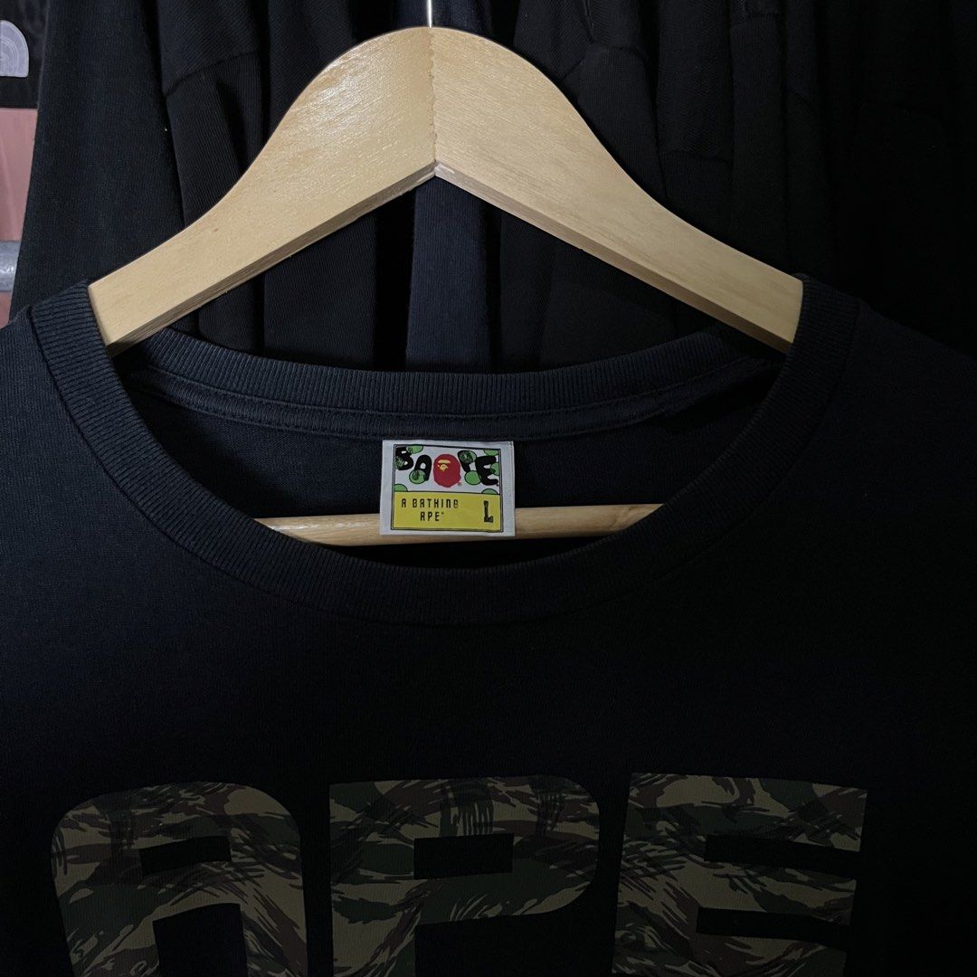 A Bathing Ape (BAPE) Trial Camo Asnka Tee (Category: Formal Shirts) located in Daet. Submitted by wearthriftingcloth. (Listing ID 1468863837, Image 3). Description: 👕BAPE Measurement: W20xL27 Issue(s): SEE ON PIC Condition: 9.5/10 Color rate: 9.5/10 ➡️Swipe- to see more detail pic 📌No Deleting/Cancelation‼️ 📌Color may Vary Due to Lighting‼️ 📌Please be responsible buyer Bogus/Flaker will be posted‼️ 📌All ltems Need Wash‼️.
