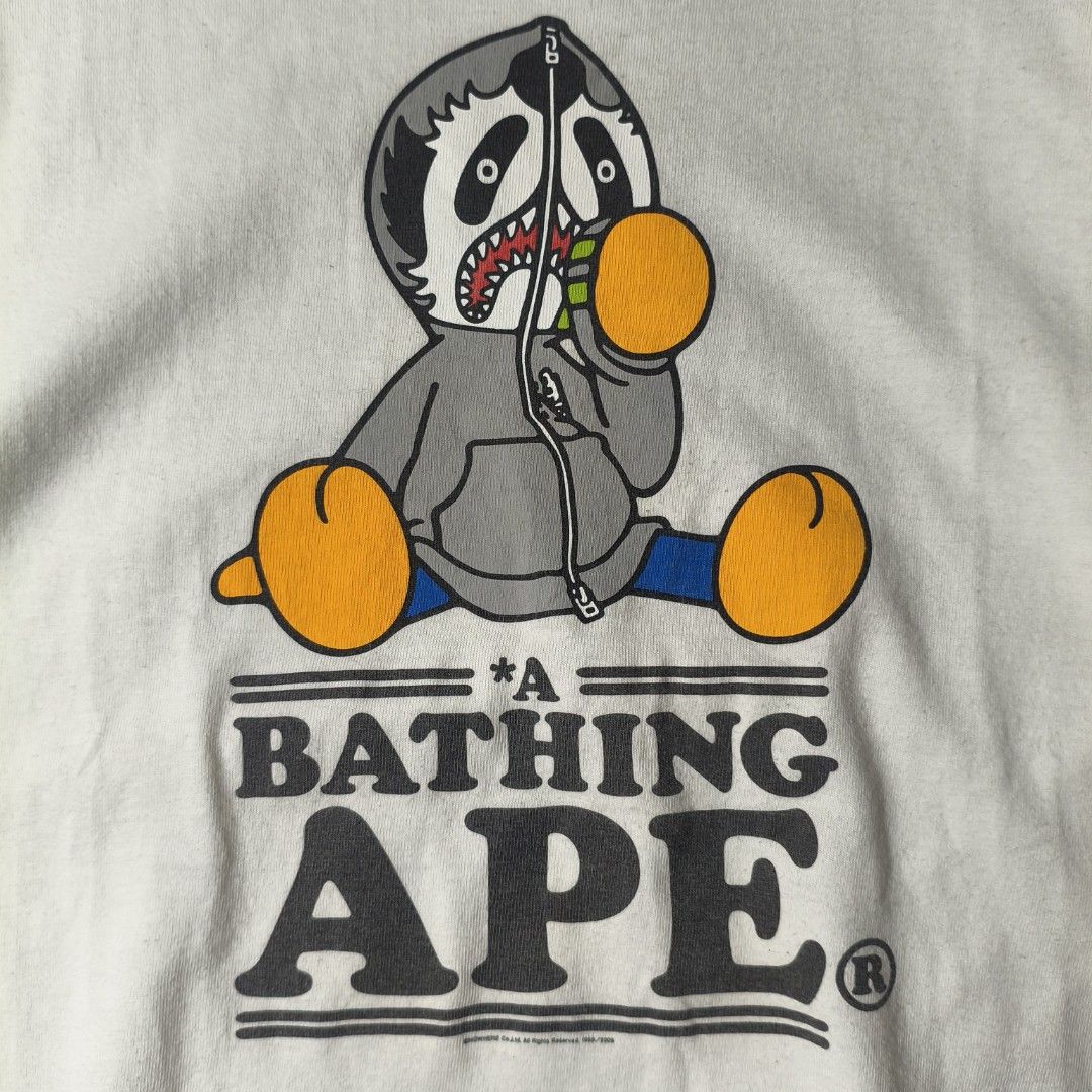 A Bathing Ape Shark Panda Graphic Tee Size M (Category: Formal Shirts) located in Butuan. Submitted by prince0922 (Listing ID 1468733533, Image 2). Description: Bape Panda OG M Size on tag: M Width: 20 Length: 28 Very Good Condition Issue: Minimal HL, graph fade Color Rate: 9.3/10 Price: 1300📥.