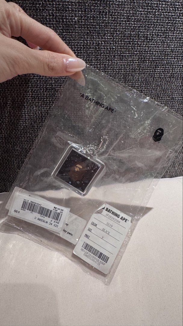 A Bathing Ape Space Camo Keychain M (Category: Shorts) located in Mandaluyong City. Submitted by maelovestoshop (Listing ID 1468874443, Image 1). Description: - 100% Authentic BAPE Space Camo acrylic keychain - Colorway: Black with silver ball chain - Design: Square shape with Ape head graphic on one side and branding on the other - Condition: Brand new in original plastic packaging with store tags attached - Perfect accessory for keys, bags, or 