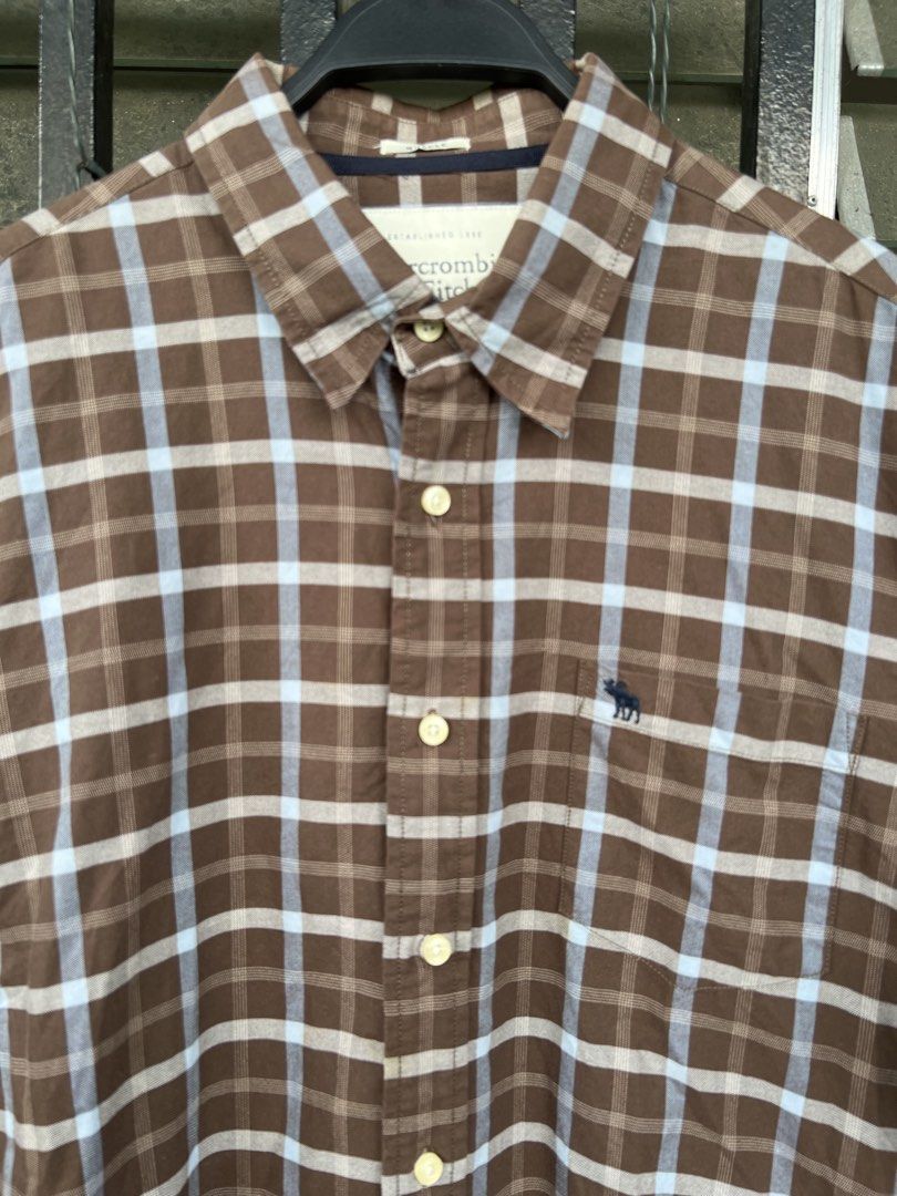 Abercrombie & Fitch Plaid Button down Shirt (Category: Formal Shirts) located in Cavite. Submitted by slumbermanila (Listing ID 1468807623, Image 2). Description: Abercrombie & Fitch Plaid Button down Shirt in good condition 100% Cotton Made in Macau see photos for right measurements .