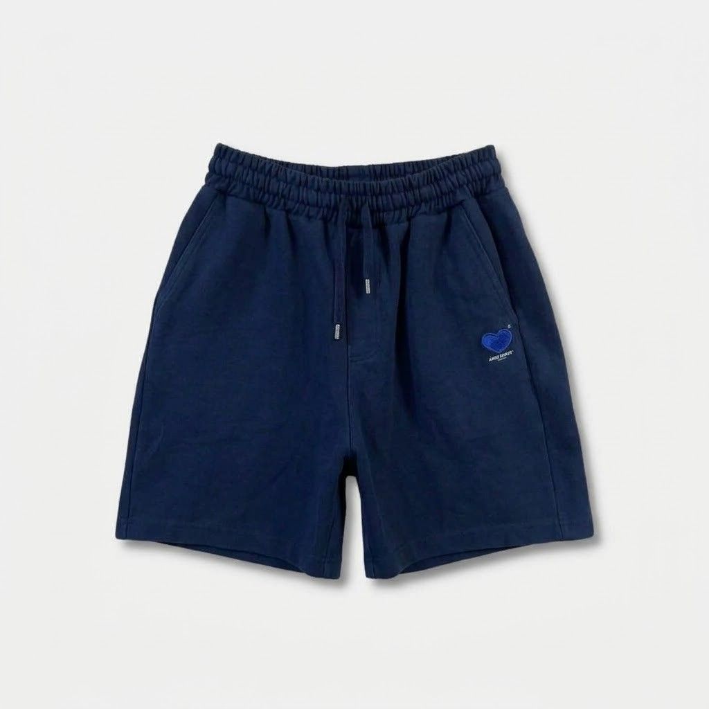 Ader Error Heart Sweatshorts Navy Blue (Category: Shorts) located in Manila. Submitted by ayskrim_ (Listing ID 1468788892, Image 1). Description: - Brand: Ader Error - Color: Navy Blue - Dimes: Length: 18 Leghole: 12 Waistline: 28-34 - Material: Premium thick cotton - Waistband: Elastic with adjustable drawstrings and branded metal aglets - Details: Blue embroidered heart patch with 'ADERERROR' and 'AFTER BLUE' lettering, side hem logo tag.