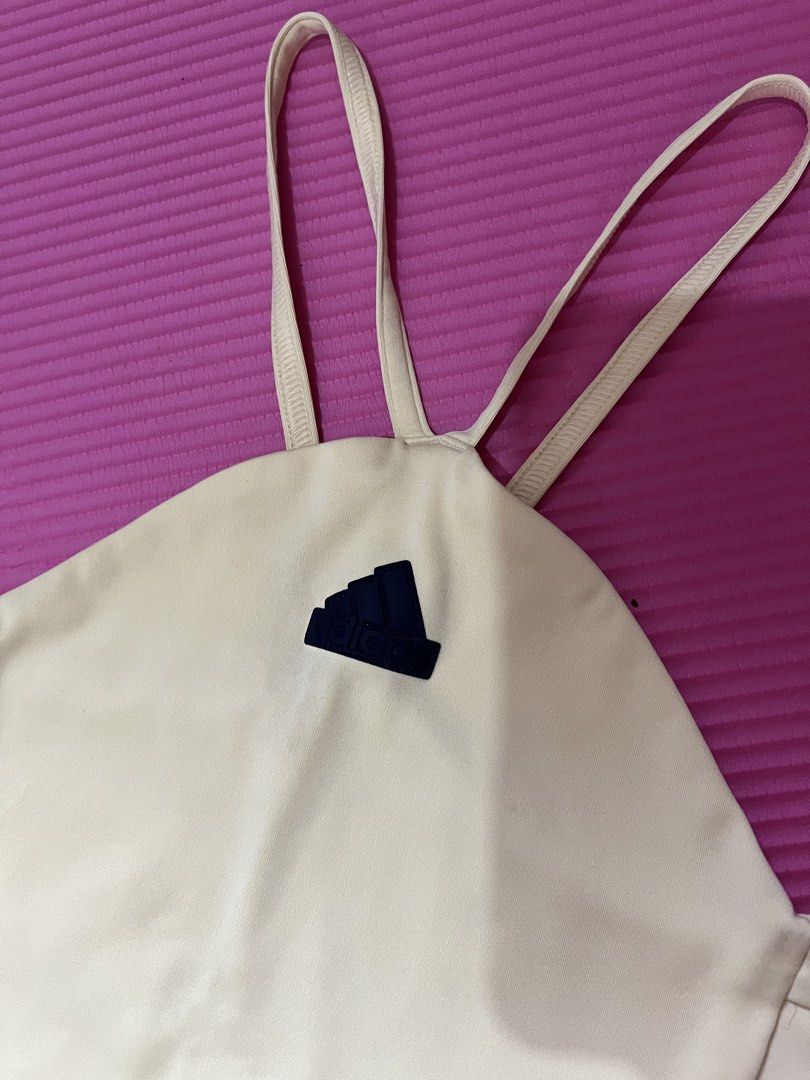 Adidas Active Crop Top Cream Black Straps (Category: Activewear) located in Rizal. Submitted by s0apandglory (Listing ID 1468773310, Image 2). Description: - Brand: Adidas - Style: Halter crop top with double-strap crisscross back - Color: Cream with classic black three-stripe details - Logo: Bold black Adidas stamp on the front - Material: Soft, high-quality athletic fabric with clean stitching - Condition: Excellent / no flaws - Perfect for: Gy