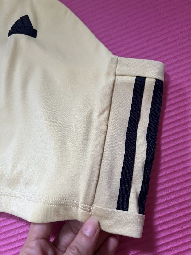 Adidas Active Crop Top Cream Black Straps (Category: Activewear) located in Rizal. Submitted by s0apandglory (Listing ID 1468773310, Image 3). Description: - Brand: Adidas - Style: Halter crop top with double-strap crisscross back - Color: Cream with classic black three-stripe details - Logo: Bold black Adidas stamp on the front - Material: Soft, high-quality athletic fabric with clean stitching - Condition: Excellent / no flaws - Perfect for: Gy