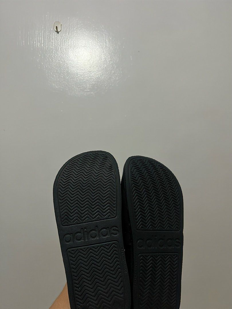 Adidas Black and White Slides (Category: Slippers and slides) located in Cebu City. Submitted by itsmegeecebu (Listing ID 1468766394, Image 2). Description: - Color: Black with white stripes - Size: US 5 / UK 5 / FR 38 / JP 235 - Origin: Made in Vietnam - Condition: Clean, soles show minimal wear - Features: Textured footbed for grip, zigzag outsole pattern - Style: Easy slip-on design for casual days or post-workout - RFS: Runs small on me. 23.5