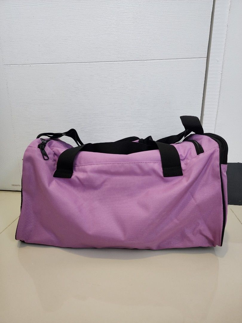 Adidas Essentials Linear Duffel Bag (Category: Shoulder Bags) located in Quezon City. Submitted by pinkyshang (Listing ID 1468827186, Image 3). Description: - Brand: Adidas - Style: Adidas Essentials Linear Duffel Bag (Size: Small) - Color: Purple with bold White branding down the side - Condition: Brand new, unused with original tags attached - Features: Dual carry handles with padded grip - Storage: Zip main compartment and interior small slip 
