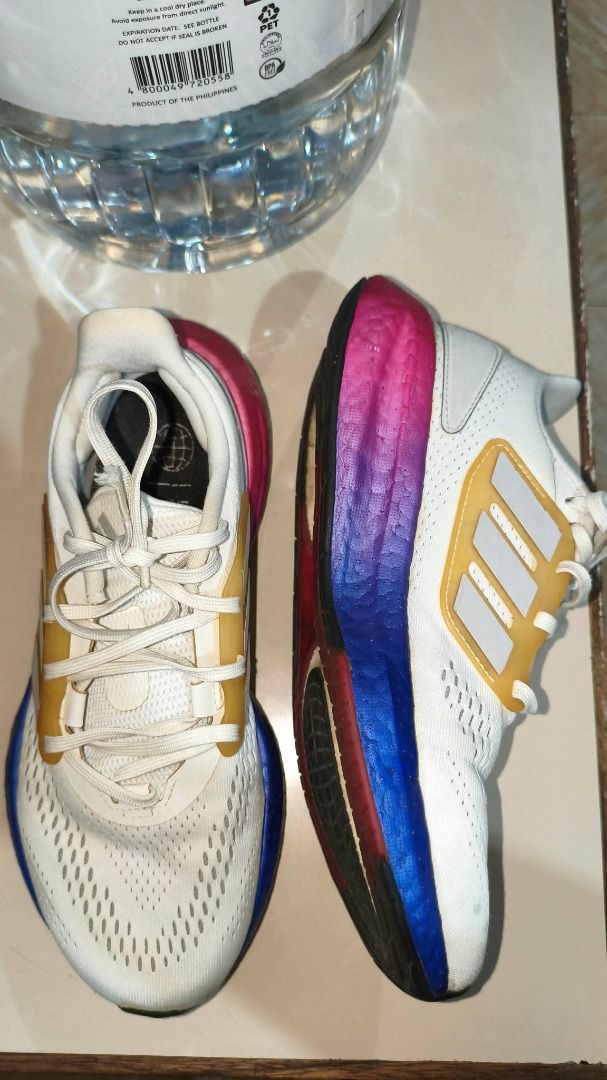 Adidas Galaxy 5- Size 6 (Category: Sneakers) located in Manila. Submitted by frances_cai (Listing ID 1468830332, Image 2). Description: - Brand: Adidas Running Shoes - Upper: White mesh with striking golden-yellow cage and laces - Midsole: Eye-catching gradient fading from pink to blue - Outsole: Durable black rubber - Condition: Used with normal signs of wear on the fabric and soles.