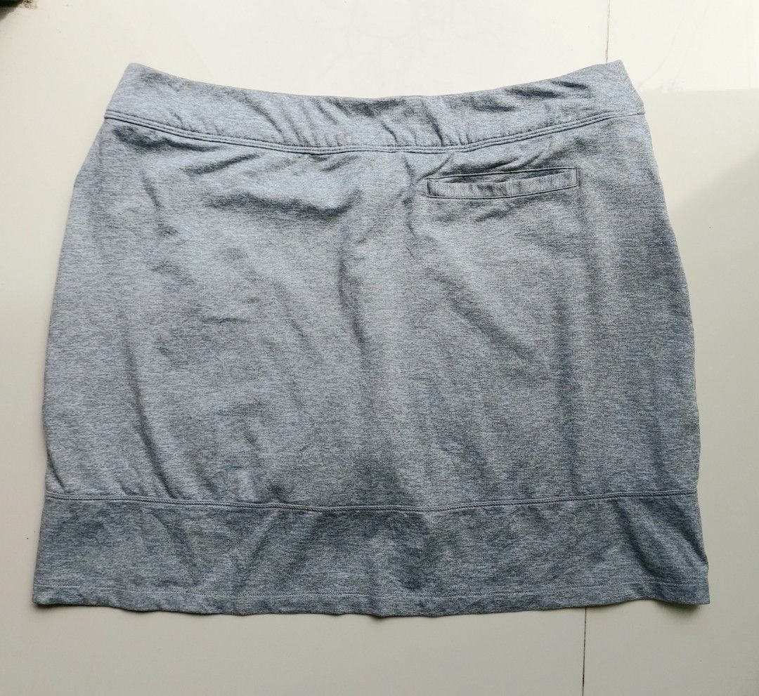 Adidas grey athletic skort with pockets (Category: Activewear) located in Lapu Lapu. Submitted by agnesapm_29813 (Listing ID 1468852817, Image 3). Description: - Brand: Adidas - Color: Grey heathered fabric - Design: Sports skirt with built-in shorts and elastic waistband - Features: Deep front pockets and small back zippered pocket - Details: Silver Adidas logo on front hem - Condition: Clean and well-maintained - Ideal for: Tennis, golf, workou
