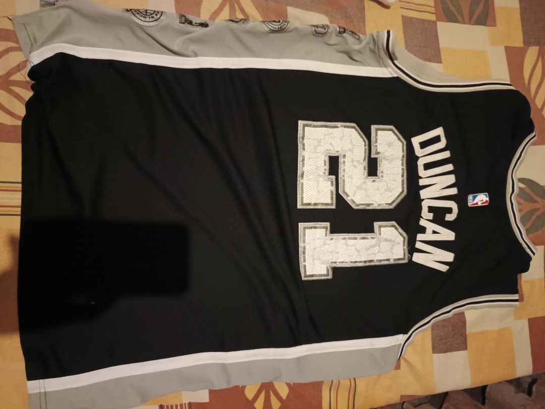 Adidas jersey (Category: Activewear) located in Odiongan. Submitted by thriftngo26 (Listing ID 1468852363, Image 2). Description: This is an Adidas San Antonio Spurs Tim Duncan #21 Swingman jersey, featuring customized side accomplishments patches and a career achievement label above the jock tag to commemorate his historic NBA career..