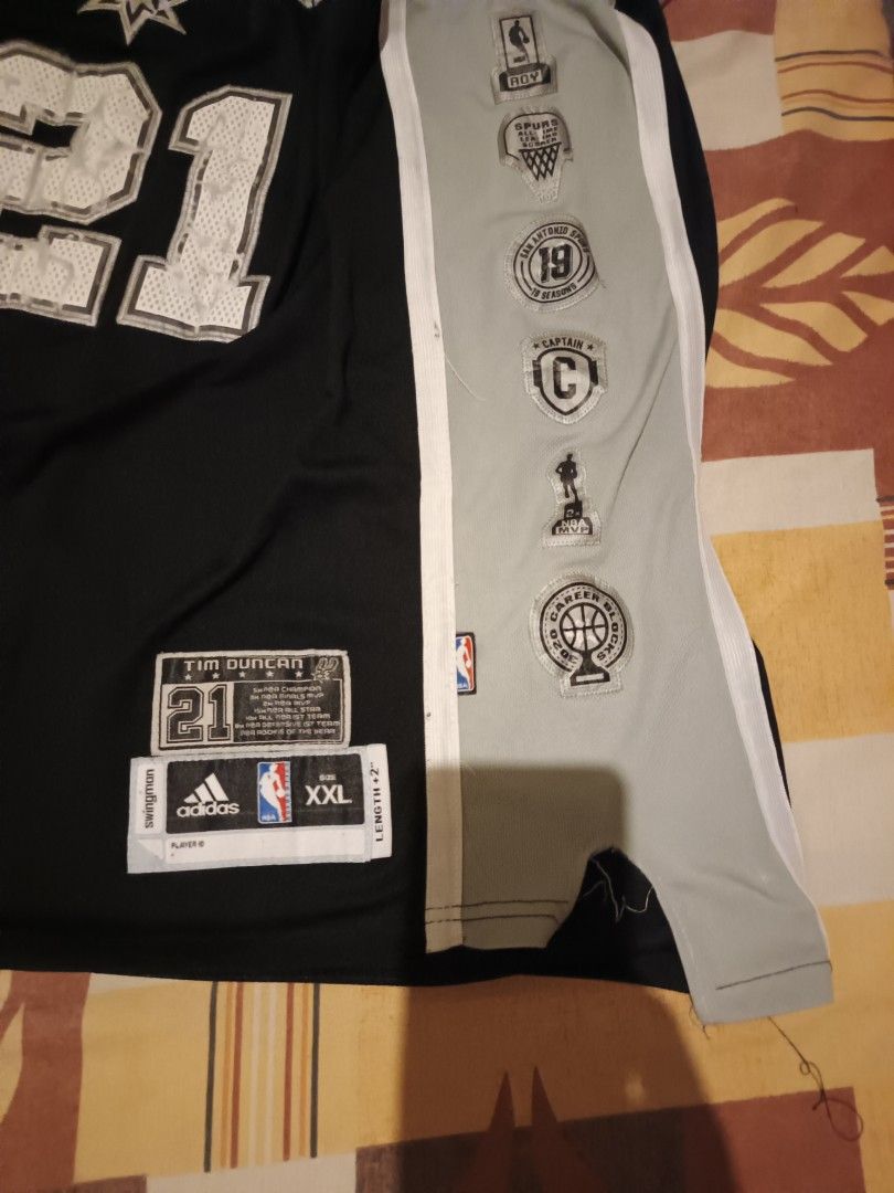 Adidas jersey (Category: Activewear) located in Odiongan. Submitted by thriftngo26 (Listing ID 1468852363, Image 3). Description: This is an Adidas San Antonio Spurs Tim Duncan #21 Swingman jersey, featuring customized side accomplishments patches and a career achievement label above the jock tag to commemorate his historic NBA career..