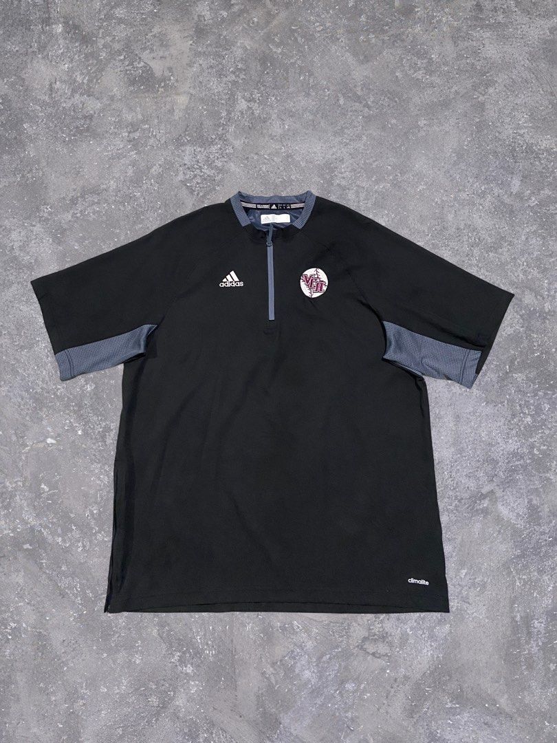 Adidas Mesh QuarterZip Shirt (Category: Activewear) located in Baguio. Submitted by chicoroy (Listing ID 1468880000, Image 1). Description: - Brand: adidas Climalite - Type: Short sleeve half-zip pullover jacket - Size: L Dimes:23.5/31 - Color: Black with grey patterned contrast trim - Details: Embroidered adidas logo and official VCA baseball team patch - Features: Side zipper vents at the hem for added comfort - Material: 100% polyester (machin