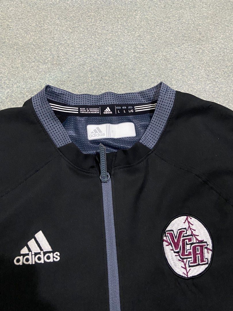 Adidas Mesh QuarterZip Shirt (Category: Activewear) located in Baguio. Submitted by chicoroy (Listing ID 1468880000, Image 2). Description: - Brand: adidas Climalite - Type: Short sleeve half-zip pullover jacket - Size: L Dimes:23.5/31 - Color: Black with grey patterned contrast trim - Details: Embroidered adidas logo and official VCA baseball team patch - Features: Side zipper vents at the hem for added comfort - Material: 100% polyester (machin