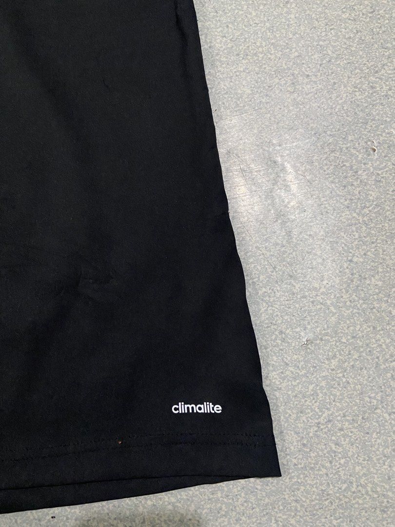 Adidas Mesh QuarterZip Shirt (Category: Activewear) located in Baguio. Submitted by chicoroy (Listing ID 1468880000, Image 3). Description: - Brand: adidas Climalite - Type: Short sleeve half-zip pullover jacket - Size: L Dimes:23.5/31 - Color: Black with grey patterned contrast trim - Details: Embroidered adidas logo and official VCA baseball team patch - Features: Side zipper vents at the hem for added comfort - Material: 100% polyester (machin