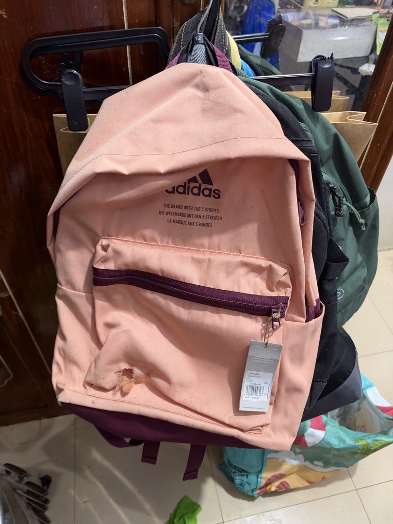Adidas Peach and Burgundy Backpack (Category: Backpacks) located in Manila. Submitted by carloasoro (Listing ID 1468809536, Image 1). Description: DECLUTTER Left unused sa cabinet May butas sa pocket pero pede naman ipatch na lang to cover Stock stains Price negotiable .