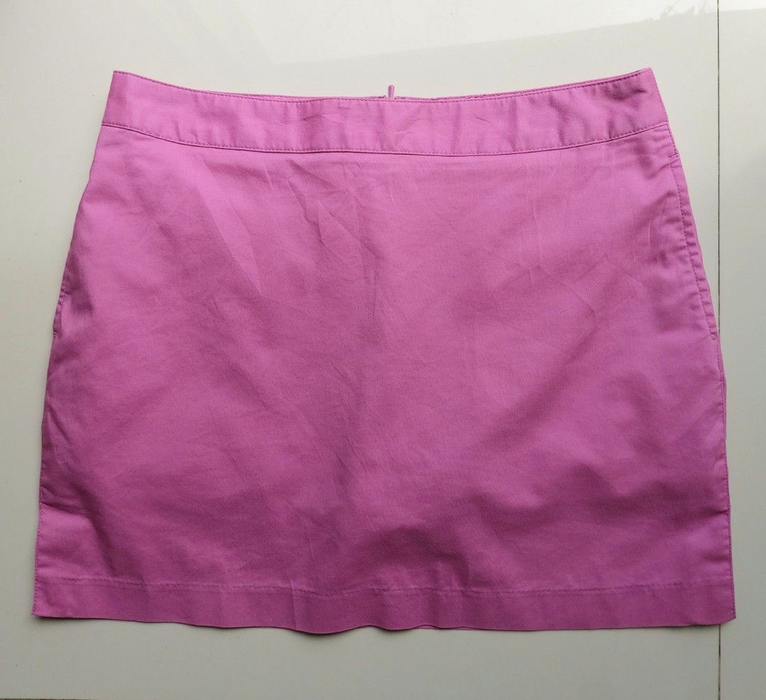 Adidas Pink Golf Skort (Category: Skirts) located in Lapu Lapu. Submitted by agnesapm_29813 (Listing ID 1468854777, Image 1). Description: - Brand: Adidas - Color: Bright pink - Size: Large on tag but can fit Medium - Activity: Designed for golf / activewear - Closure: Side zip with smooth YKK hardware - Pocket: Back pocket with button closure and embroidered Adidas logo - With built in shorts inside - Measurements: waist-29 inches, height-14 inc