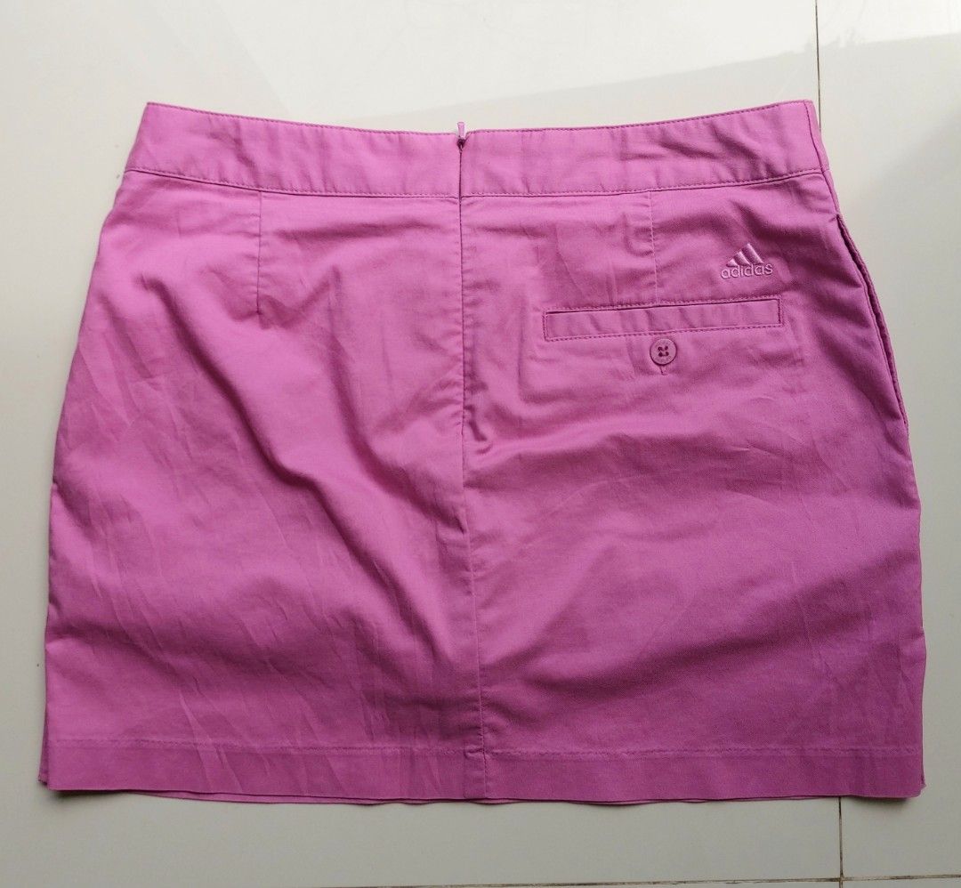 Adidas Pink Golf Skort (Category: Skirts) located in Lapu Lapu. Submitted by agnesapm_29813 (Listing ID 1468854777, Image 3). Description: - Brand: Adidas - Color: Bright pink - Size: Large on tag but can fit Medium - Activity: Designed for golf / activewear - Closure: Side zip with smooth YKK hardware - Pocket: Back pocket with button closure and embroidered Adidas logo - With built in shorts inside - Measurements: waist-29 inches, height-14 inc