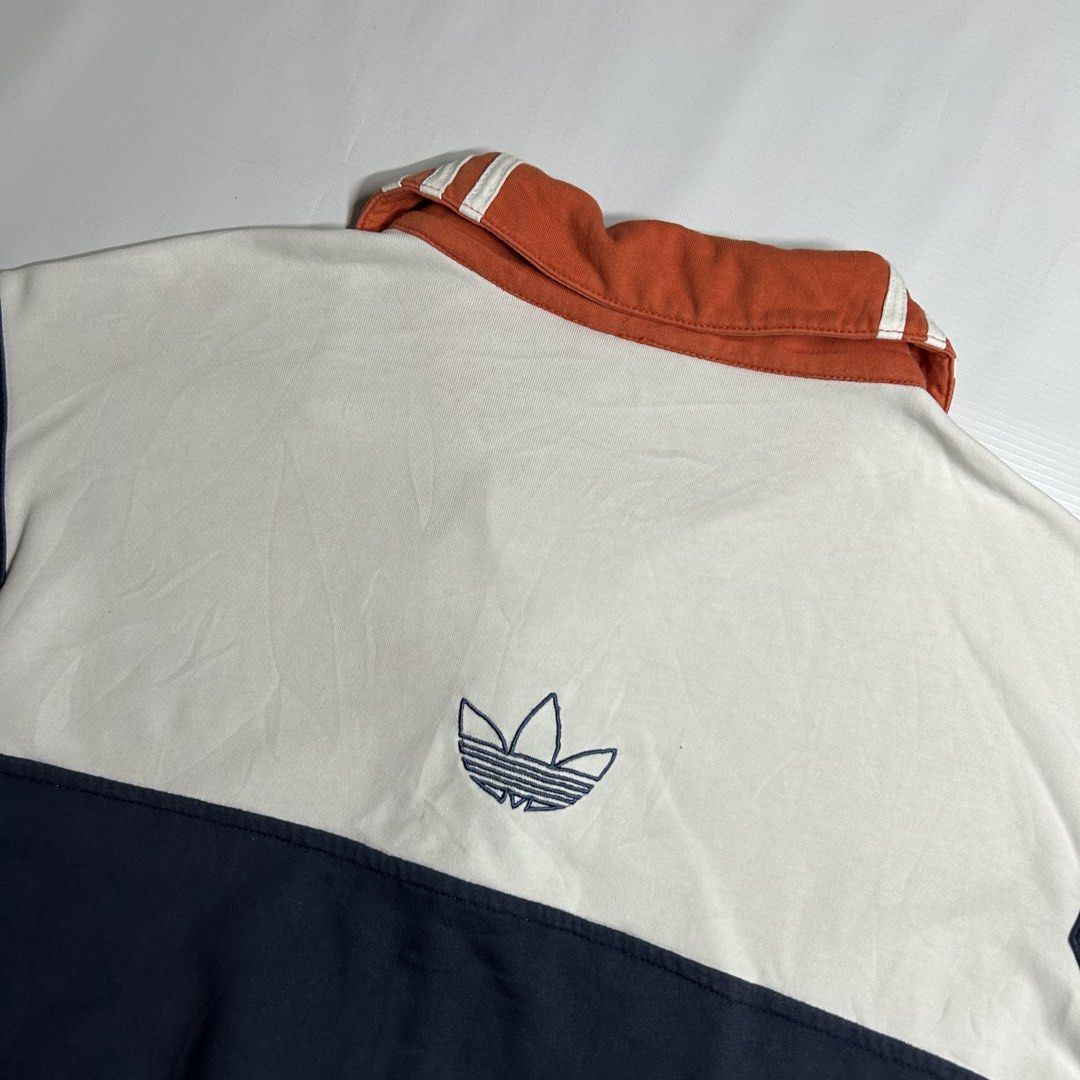 Adidas Quarter Button Sweater (Category: Tshirts & Polo Shirts ) located in Antipolo. Submitted by wvyfrnds (Listing ID 1468751050, Image 3). Description: Adidas Quarter Button Sweater Size: M Color: White/NavyBlue/Peach Dimensions (Inches): Length: 24.5 Width: 24 Color Rate: 9/10 Issues - Light color bleed (Not Visible) 395 PLUS SF.