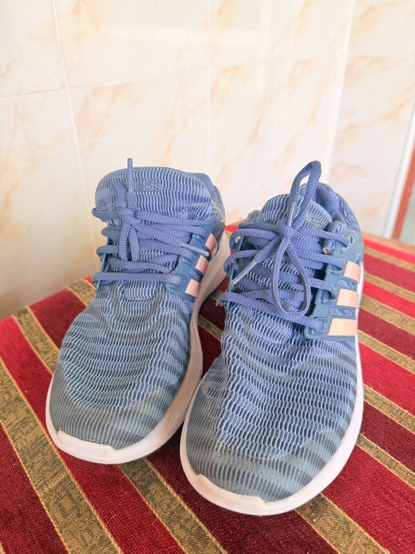 Adidas running shoes blue pink (Category: Sneakers) located in Manila. Submitted by sedpuprincess (Listing ID 1468785683, Image 2). Description: - Color: Blue with light pink stripes and light blue laces - Material: Breathable knit mesh upper with durable white rubber sole - Closure: Lace-up front - Branding: Adidas logo embossed on tongue and side cage - Best for: Daily workouts, running errands, or casual walking - Condition: Brand new / Excell