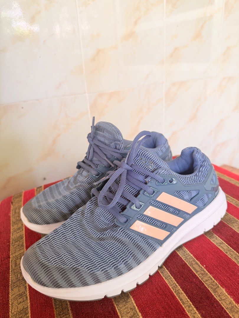 Adidas running shoes blue pink (Category: Sneakers) located in Manila. Submitted by sedpuprincess (Listing ID 1468785683, Image 1). Description: - Color: Blue with light pink stripes and light blue laces - Material: Breathable knit mesh upper with durable white rubber sole - Closure: Lace-up front - Branding: Adidas logo embossed on tongue and side cage - Best for: Daily workouts, running errands, or casual walking - Condition: Brand new / Excell