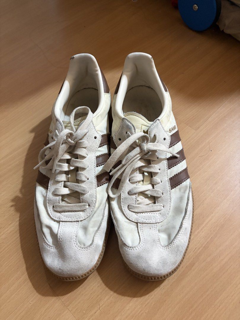 Adidas Samba White Brown Sneakers (Category: Sneakers) located in Manila. Submitted by smmcruz (Listing ID 1468813857, Image 2). Description: - Model: Adidas Samba - Size US 11 - Colorway: White and Brown - Design: Classic low-top with suede toe overlay and gum sole - Details: Lace-up closure with signature gold foil SAMBA lettering - Condition: Normal signs of wear on uppers and insoles from regular use - Style: Versatile streetwear essential th