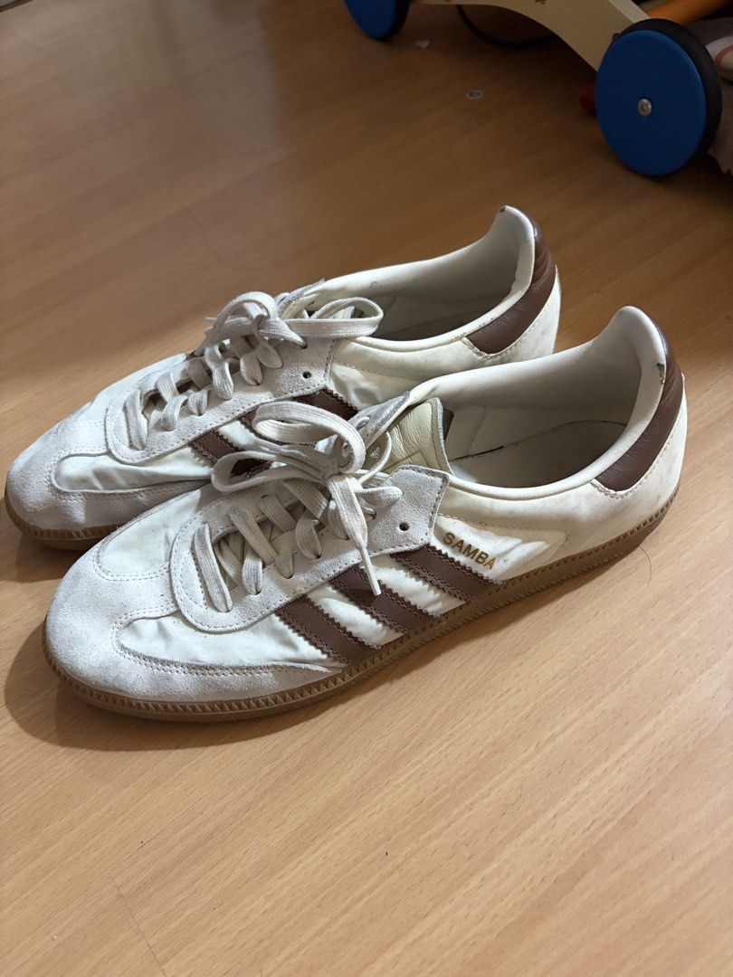 Adidas Samba White Brown Sneakers (Category: Sneakers) located in Manila. Submitted by smmcruz (Listing ID 1468813857, Image 1). Description: - Model: Adidas Samba - Size US 11 - Colorway: White and Brown - Design: Classic low-top with suede toe overlay and gum sole - Details: Lace-up closure with signature gold foil SAMBA lettering - Condition: Normal signs of wear on uppers and insoles from regular use - Style: Versatile streetwear essential th