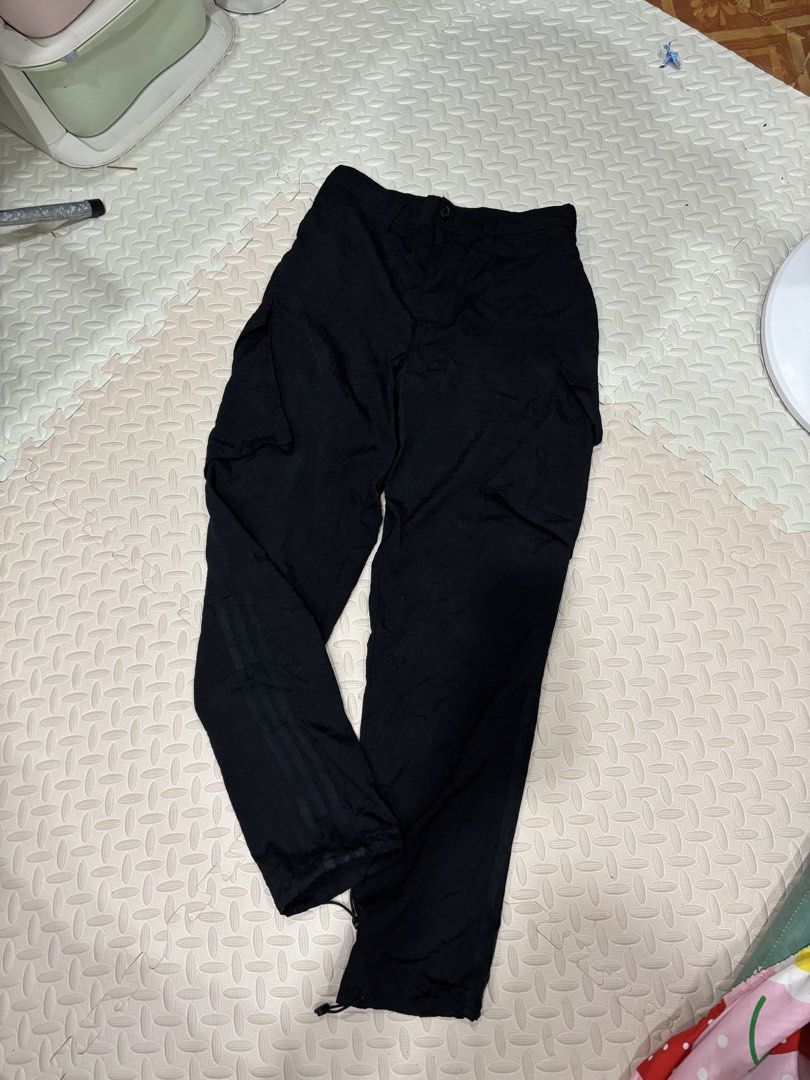Adidas Skateboarding Cargo Pants Black (Category: Joggers) located in Manila. Submitted by noribrahim.20 (Listing ID 1468874514, Image 1). Description: - Brand: Adidas Skateboarding - Color: Black with subtle all-over hexagon texture - Size: 30/32 (170/76A) - Features: Multiple utility pockets with back brand patches - Fit: Adjustable bungee cords at leg openings - Branding: Classic three stripes on lower leg - Condition: Clean piece with great d