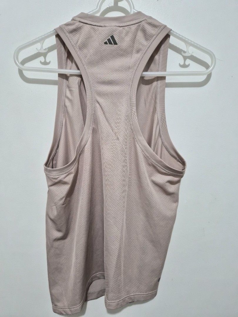Adidas Training Aeroready Tank Top (Category: Activewear) located in Mandaluyong City. Submitted by joyce1593 (Listing ID 1468818662, Image 2). Description: - Authentic Adidas training tank top in a chic dusty pink shade - Aeroready moisture-wicking fabric keeps you dry and cool during workouts - Breathable all-over mesh texture for enhanced ventilation - Stylish racerback design with subtle Adidas logos on the upper back and lower hem - Size: S 