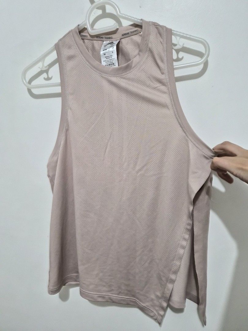 Adidas Training Aeroready Tank Top (Category: Activewear) located in Mandaluyong City. Submitted by joyce1593 (Listing ID 1468818662, Image 1). Description: - Authentic Adidas training tank top in a chic dusty pink shade - Aeroready moisture-wicking fabric keeps you dry and cool during workouts - Breathable all-over mesh texture for enhanced ventilation - Stylish racerback design with subtle Adidas logos on the upper back and lower hem - Size: S 
