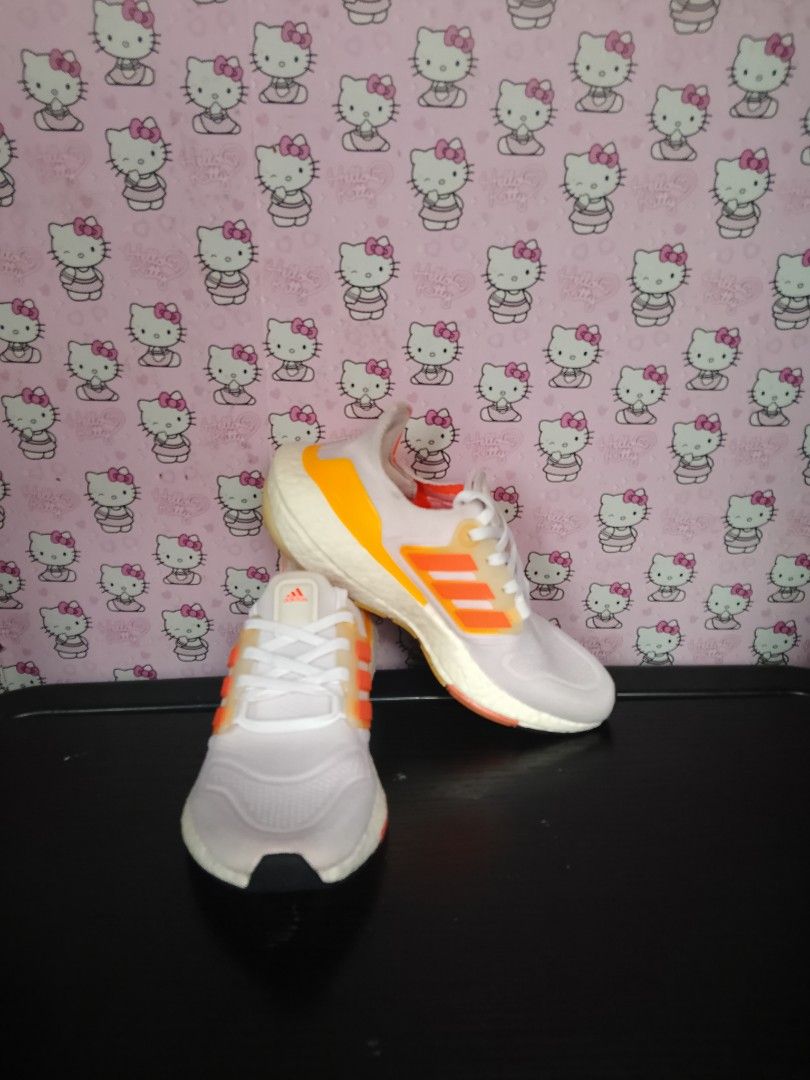 Adidas Ultraboost 22 (Category: Sneakers) located in San Jose del Monte. Submitted by azetor (Listing ID 1468774389, Image 2). Description: Adidas Ultraboost 22 running shoes in a white colorway with vibrant orange and yellow gradient details. Classic Primeknit upper and Boost midsole cushioning. Orange stripes on the midfoot cage and matching heel counter. White laces and orange insoles. - used no box - great condition - perfect for gym running 
