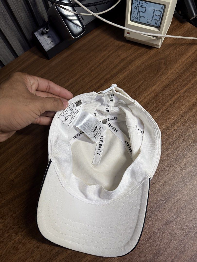 Adidas White Aeroready Baseball Cap (Category: Caps & Hats) located in San Rafael. Submitted by jeremybelza (Listing ID 1468927758, Image 3). Description: - Brand: Adidas - Color: Crisp white with a black logo - Tech: Aeroready moisture-wicking sweatband - Fit: Adjustable strap with a buckle (One size fits most) - Ideal for: Gym workouts, running, or casual daily wear.